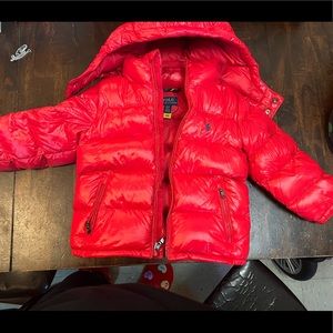 This is a red polo bubble jacket for boys. This jacket is in new condition.
